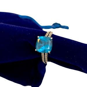 Sterling silver ring with lab created blue stone